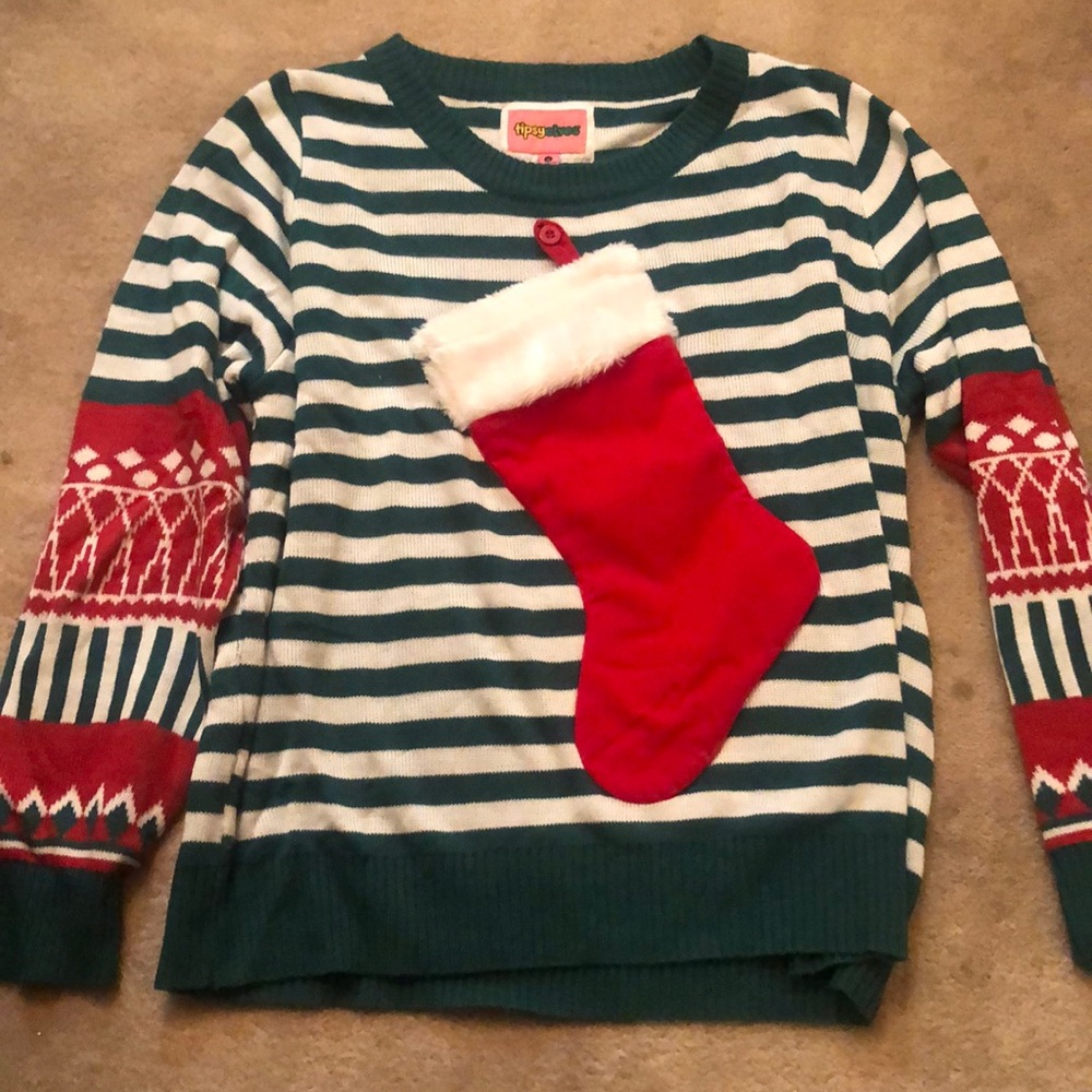 Tacky Christmas sweater that holds wine bottle